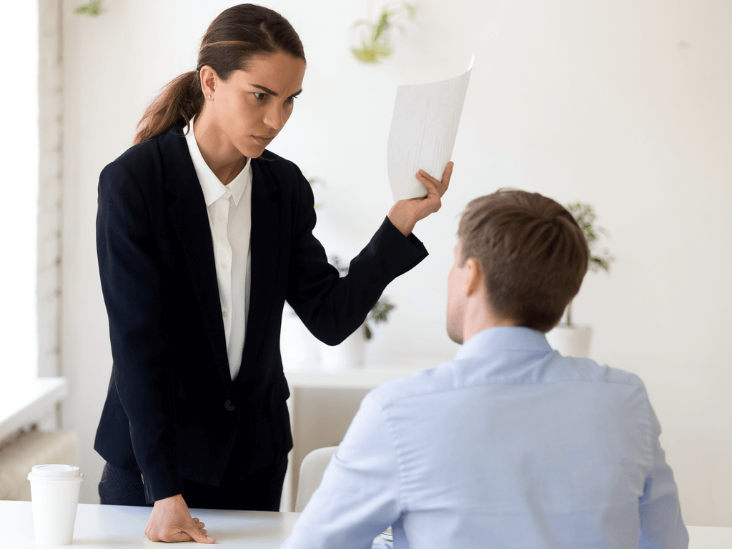 woman subjecting worker to employee discipline